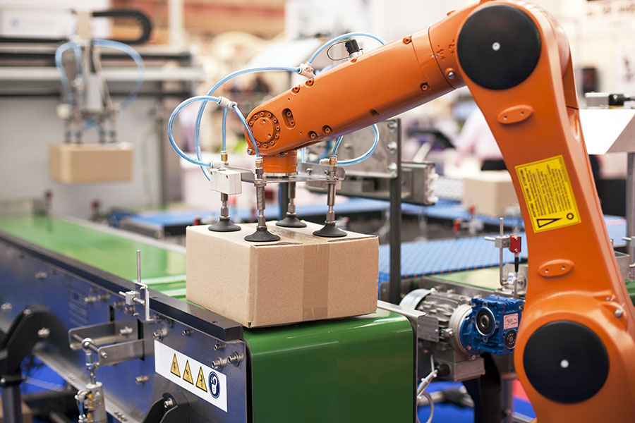 Robotic packaging machine in a factory